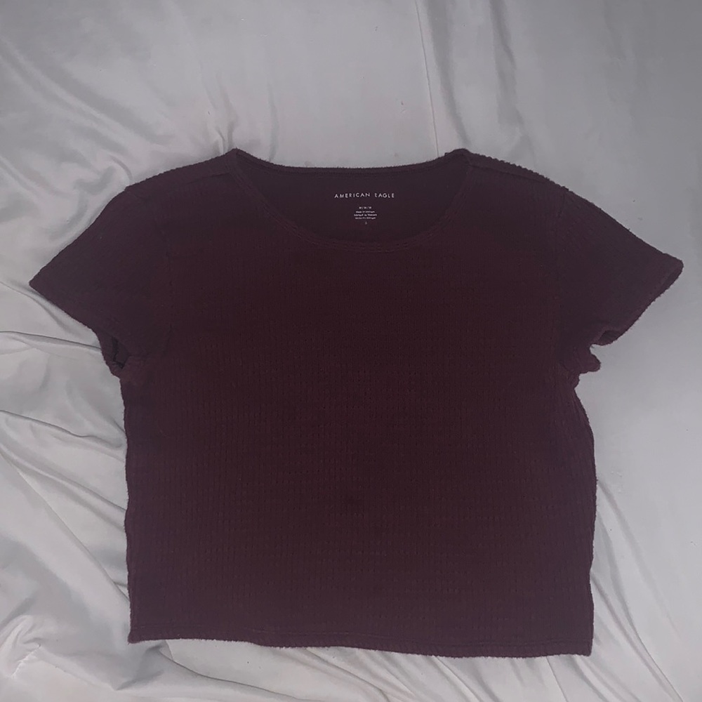 A knitted burgundy short sleeve top